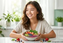 Smiling teenage girl with clear skin holding a colorful smoothie bowl topped with berries, kiwi, spinach, nuts and seeds, representing the best diet for teenager's skin